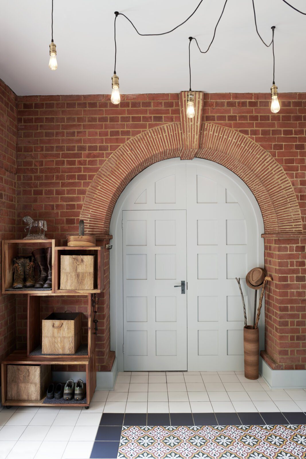 Interior entrance with exposed brickwork and feature light