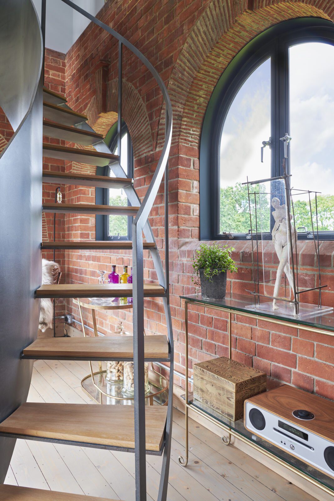 Interior view of the steel staircase and semi-circular windows