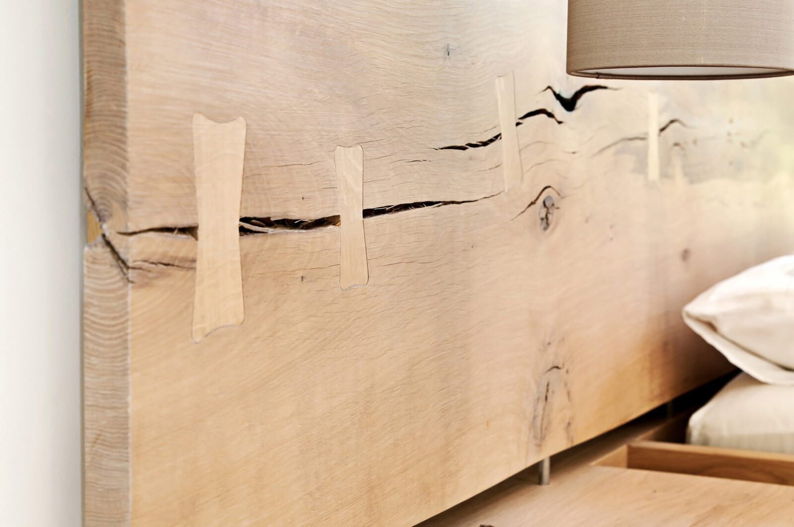 Crafted oak headboard to the master bed